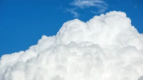 White cloud on a blue sky for a background. Stock Photos