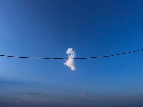White cloud in the blue sky on the beach Stock Photos