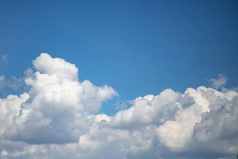 White cloud in blue sky. Bright cumulus cloud background. Natural sky atmosph Stock Photos