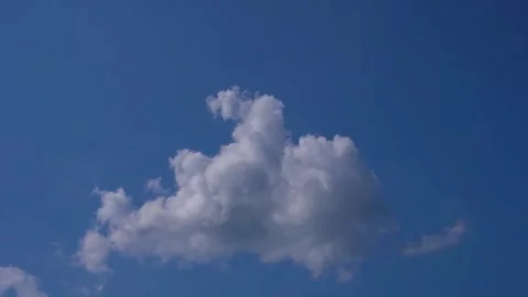 A white cloud in the blue sky Stock Footage 245719007