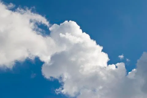 White cloud in a blue sky Stock Photos