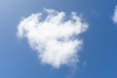 White Cloud in a Blue Sky. Stock Photos