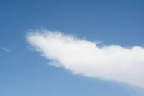 White Cloud in a Blue Sky. Stock Photos
