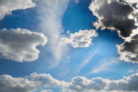 White cloud in the blue sky in sunlight Stock Photos