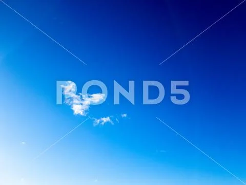 White cloud in the blue sky in winter close-up. Stock Photos