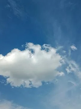 White Cloud on Clear Blue Sky Stock Photos