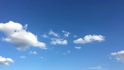 White cloud disappear in the hot sun on blue sky. Cumulus clouds form against a  Stock Footage 90237587