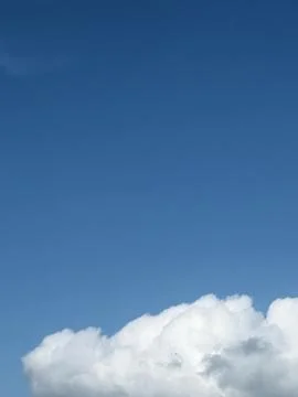 White Cloud Edge Against Clear Blue Sky Stock Photos