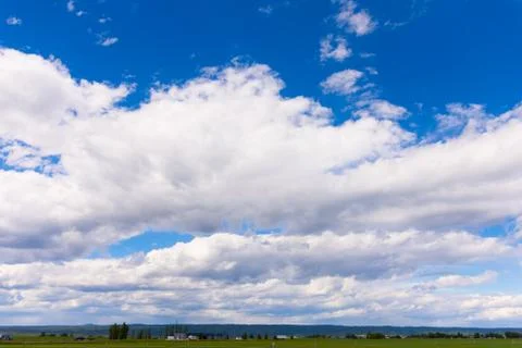 White cloud filled sky Stock Photos