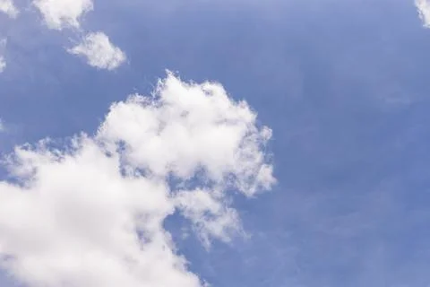 White Cloud Formation Across an Open Blue Daylight Sky Stock Photos