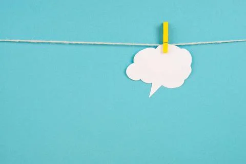 White cloud hanging on a line, empty copy space for text, blue background,... 스톡 사진