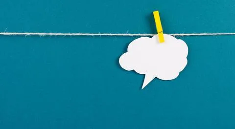 White cloud hanging on a line, empty copy space for text, blue background,... Stock Photos