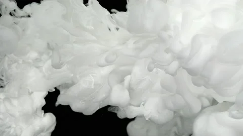 White cloud of ink on a black background. Slow motion Video stock 164762555