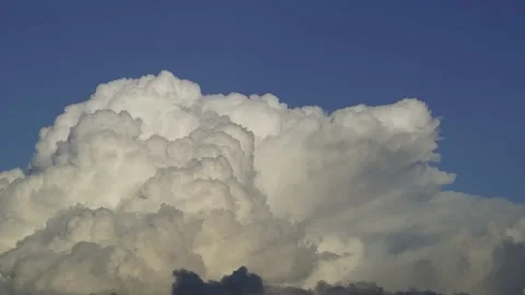 White cloud mounding steam in tumultuous growth Stock Footage 144597929
