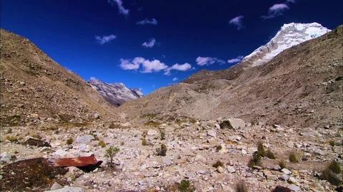 White cloud moving over rocky terrain Stock Footage 77444977