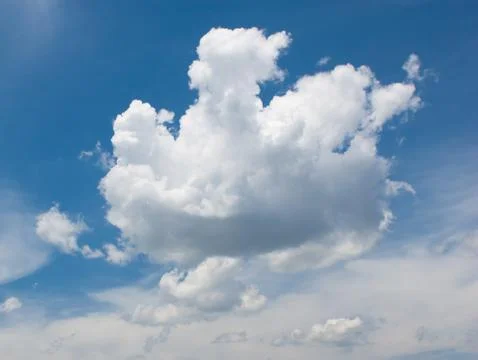 White cloud over deep blue sky background Stock Photos