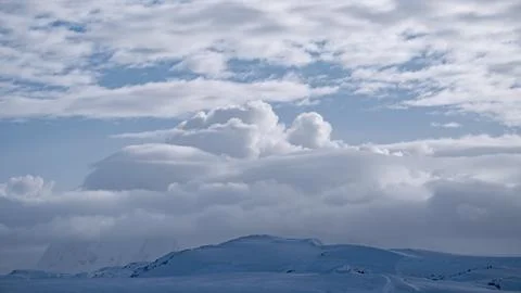 White cloud over mountain range aerial. Antarctica desert landscape of polar Stock Photos