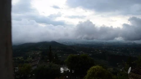 White cloud passing lower than hilltop town in Italy Stock Footage 133339686