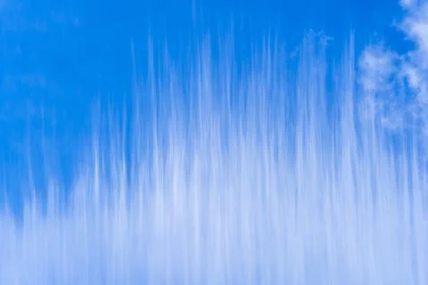 White cloud stripes over the blue sky background Stock Photos