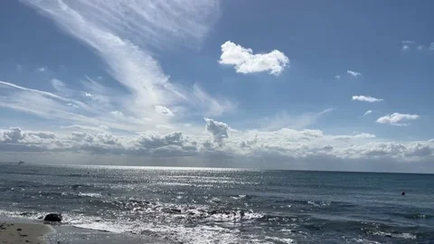 White clouds above the sea on the beach Stock Footage 212871885