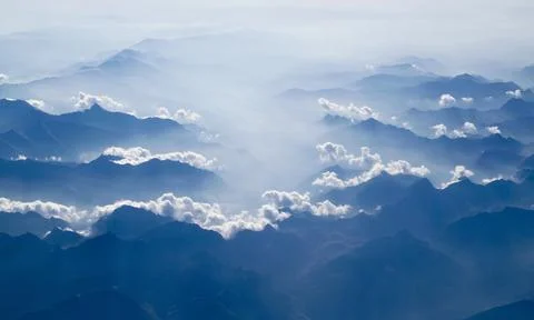 White Clouds Above Silhouette of Clouds Stock Photos