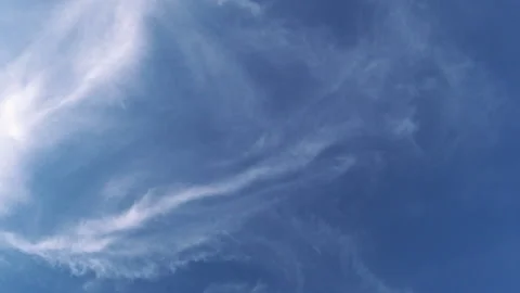 White clouds against blue sky at sunset Stock Footage 157933979