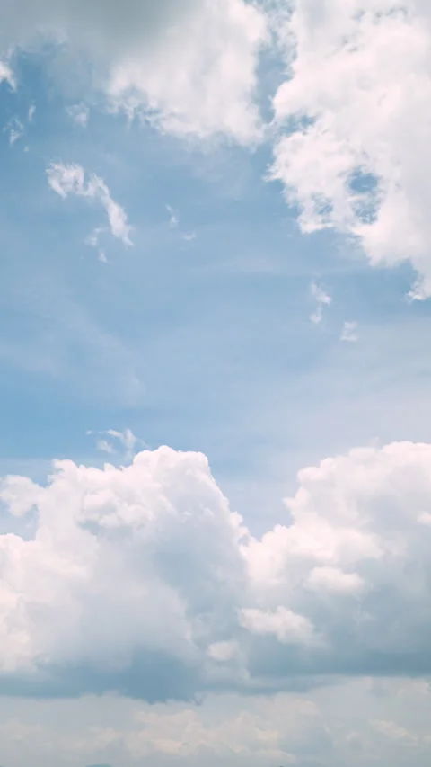 White Clouds Against Blue Sky in Summer (Vertical | Time Lapse) Stock Footage 312423211