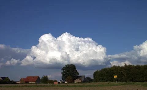 White clouds against the blue sky. Stock Photos
