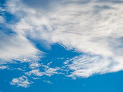 White clouds against blue sky background Stock Photos