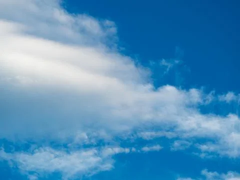 White clouds against blue sky background Stock Photos