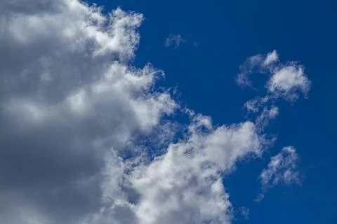 White clouds against the blue sky Stock Photos