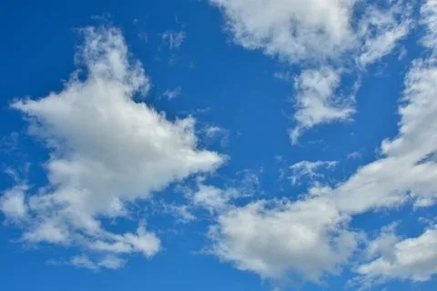 White clouds against blue sky for a backgrounds Stock Photos