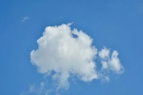 White clouds against blue sky for a backgrounds. Stock Photos