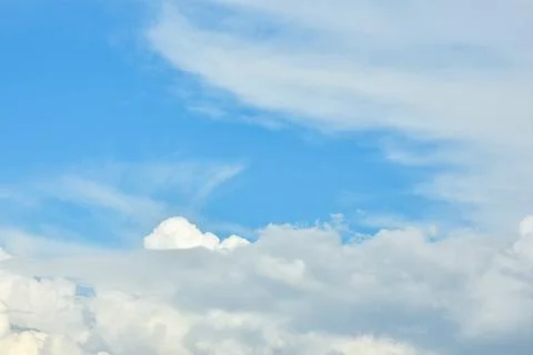 White clouds against blue sky for a backgrounds. Stock Photos