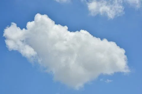 White clouds against blue sky for a backgrounds. Stock Photos