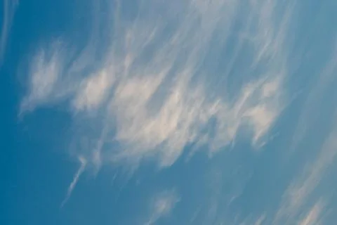 White clouds against a blue sky Stock Photos