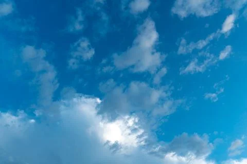 White clouds against a blue sky Stock Photos