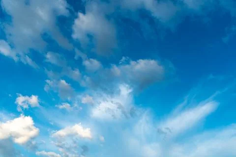White clouds against a blue sky Stock Photos