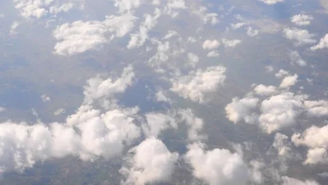 White Clouds and Blue Sky through the flight window, India, Southeast, Asia Stock Footage 77415898