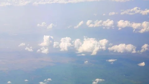 White Clouds and Blue Sky through the flight window, India, Southeast, Asia Stock Footage 77415933