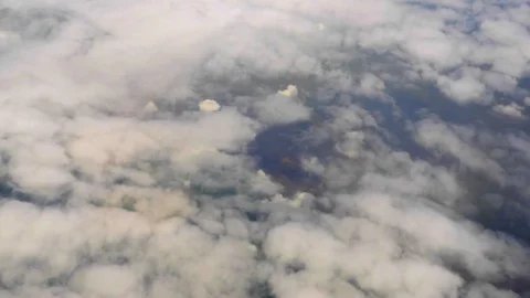 White Clouds and Blue Sky through the flight window, India, Southeast, Asia Stock Footage 77415969
