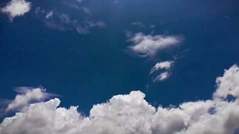 White clouds and a bright blue sky in a time lapse shot. Stock Footage 252631550