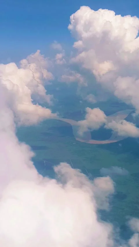 White clouds and the Kapuas River seen from the airplane window Stock Footage 311308075