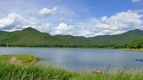 White clouds and mountain backdrops and lakes Stock Footage 91633900