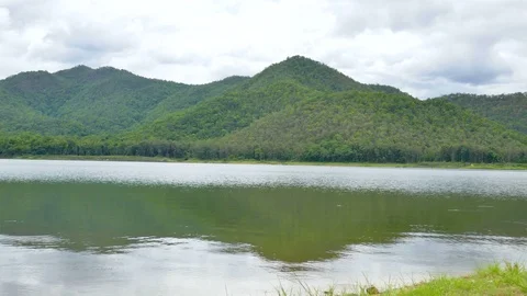 White clouds and mountain backdrops and lakes Stock Footage 91634718