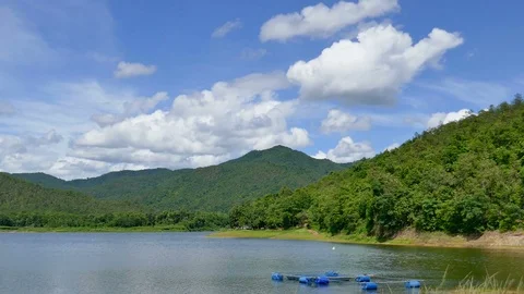 White clouds and mountain backdrops and lakes Stock Footage 91636588