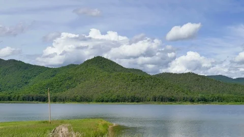 White clouds and mountain backdrops and lakes Stock Footage 91636821