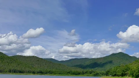 White clouds and mountain backdrops and lakes Stock Footage 91637044