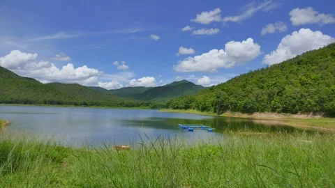 White clouds and mountain backdrops and lakes Stock Footage 91637230