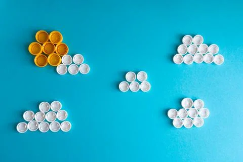 White clouds and the Sun made of plastic bottle caps Stock Photos